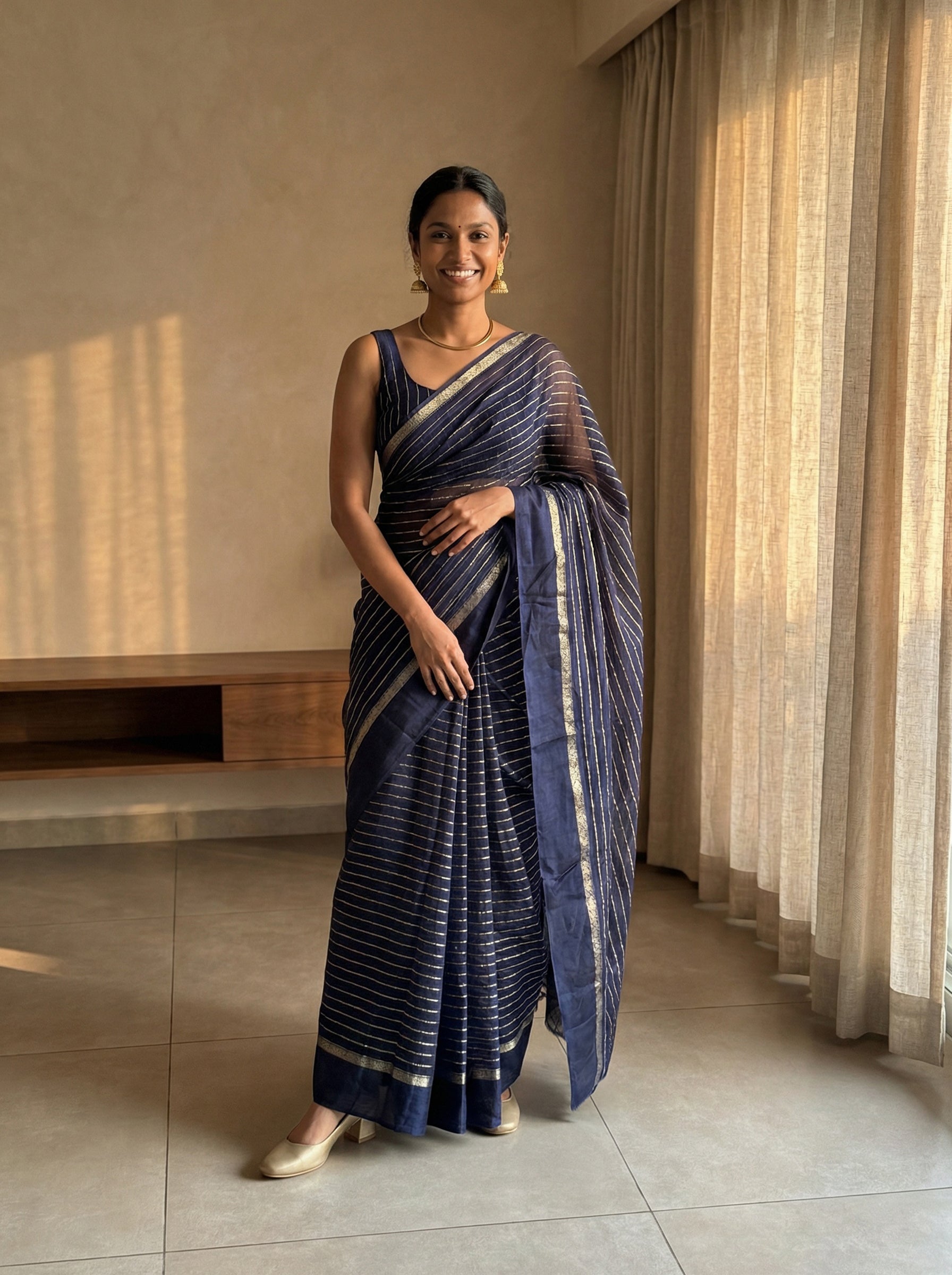 Synthetic Navy Blue Saree with Elegant Gold Stripe Pattern