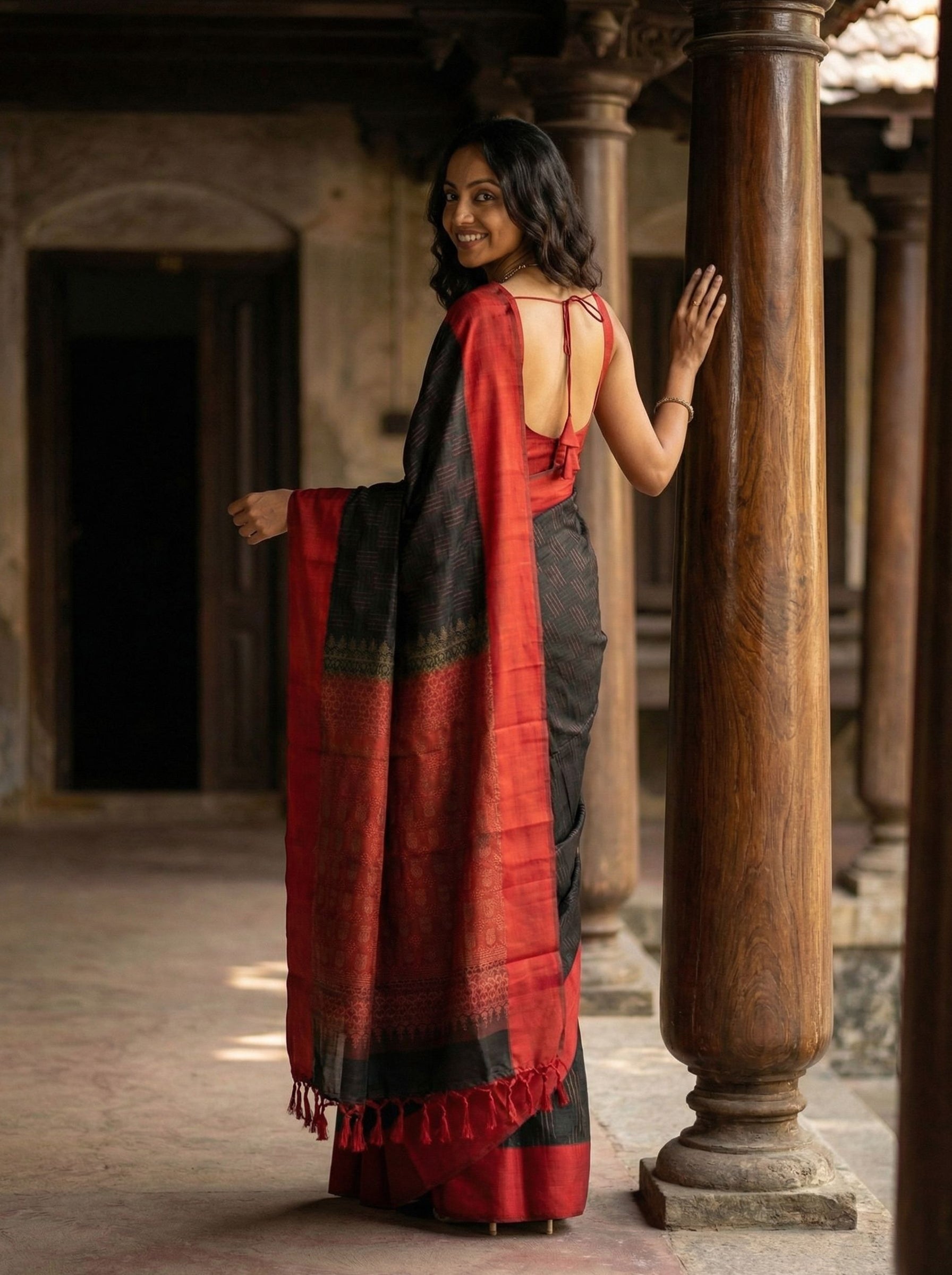 Kanjivaram silk Black and Red Ikat Weave Saree with Tassels