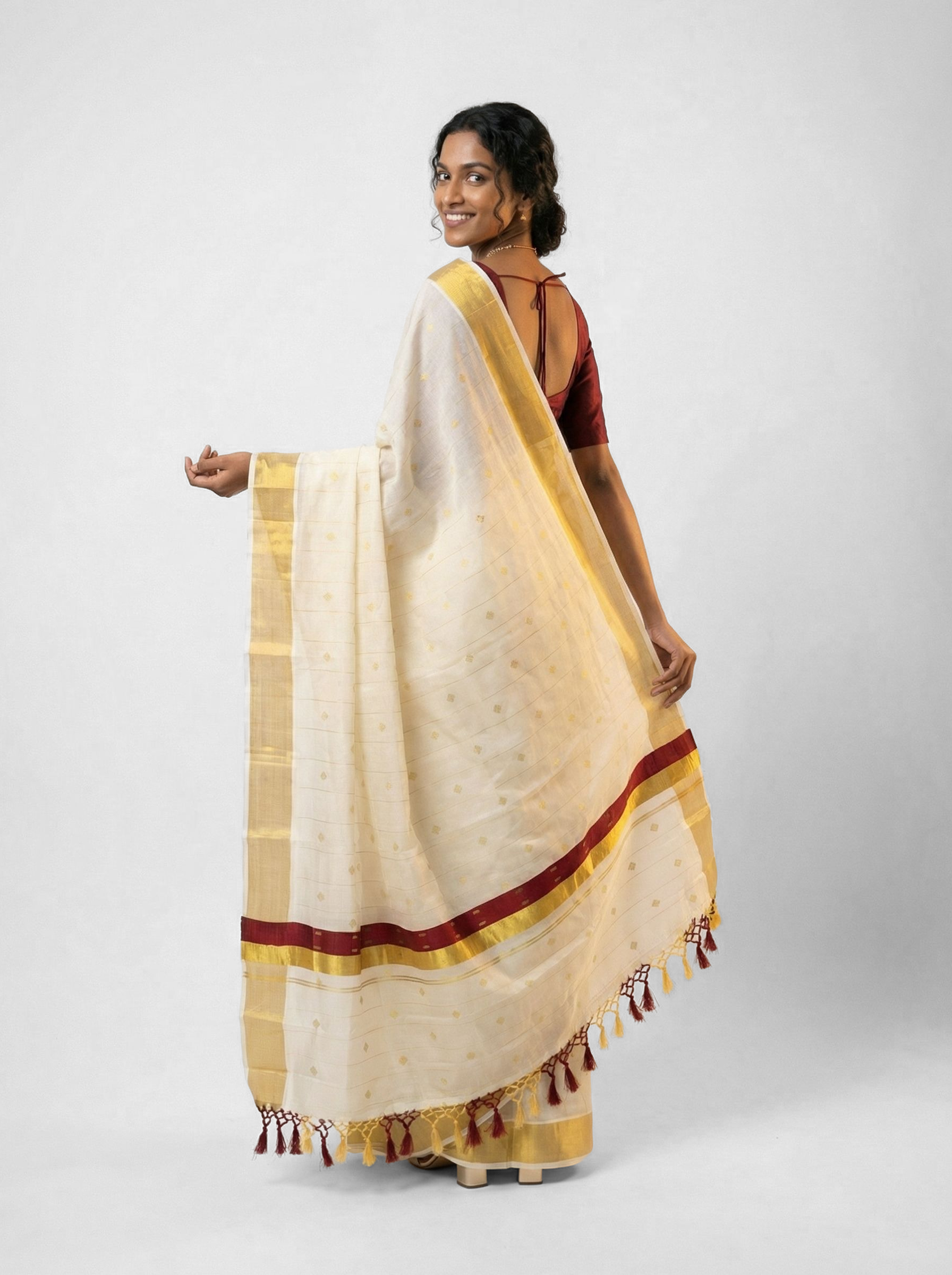 Cotton Kasavu Off-White & Gold All-Over Woven Buttas with Red Accent & Gold Zari Border Traditional Saree with Tassel Detail