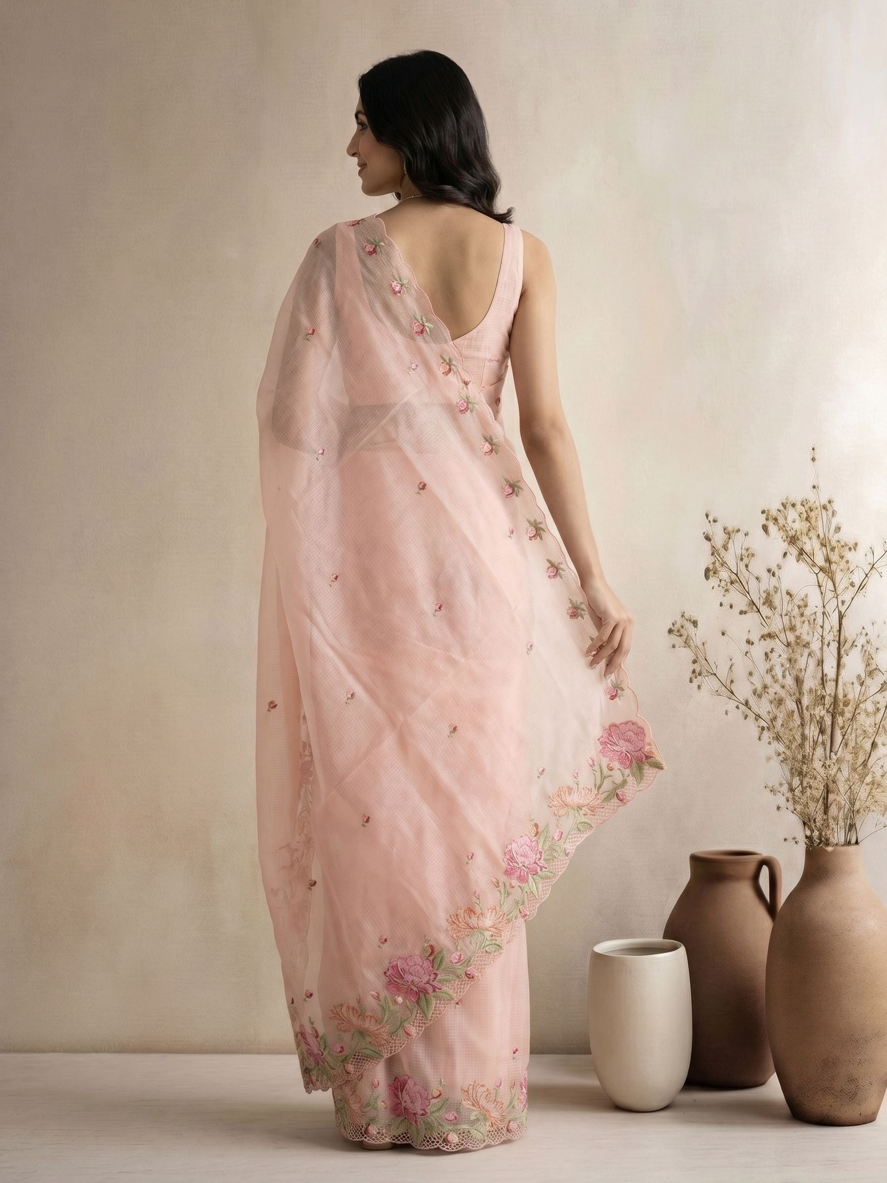 Net Cotta Peach Saree with Pink Floral Embroidered Border and Scattered Floral Motifs