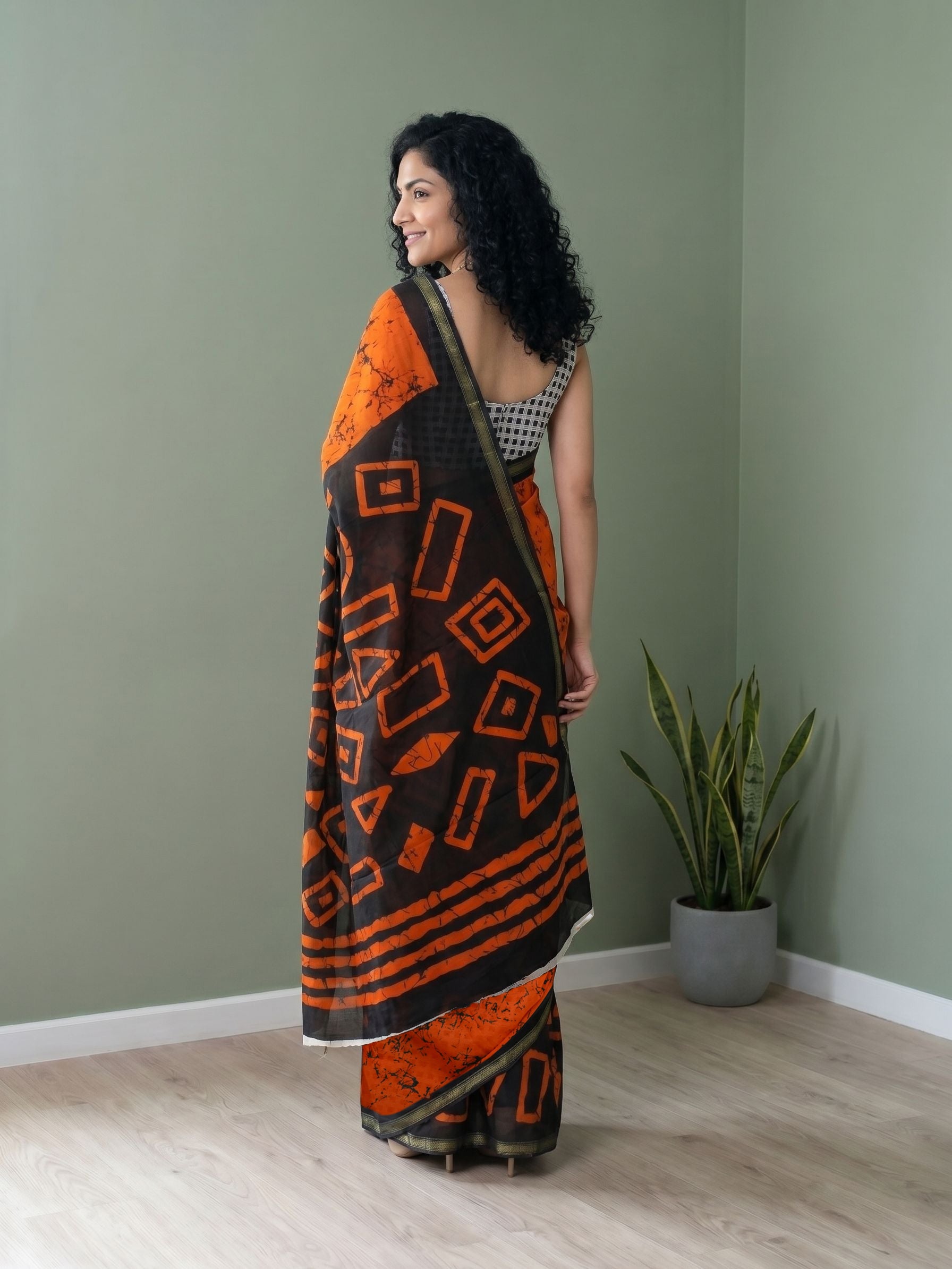 Cotton Orange and Black Geometric Batik Saree with Zari Border