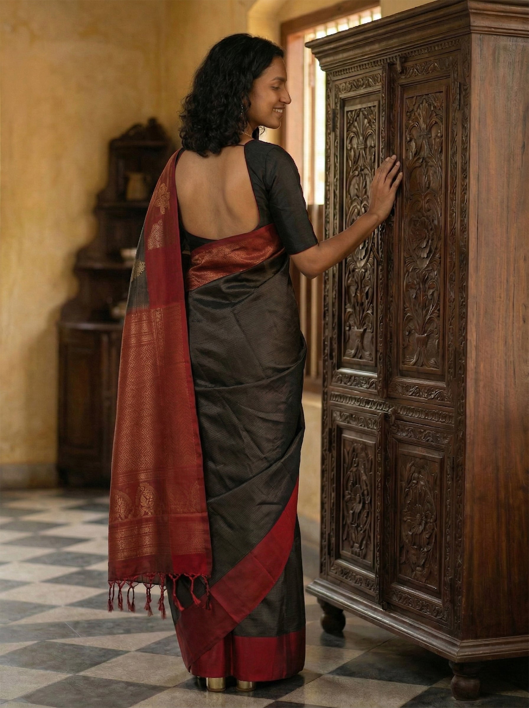 Kanjivaram silk Jet Black and Maroon Saree with Woven Butas and Tassels