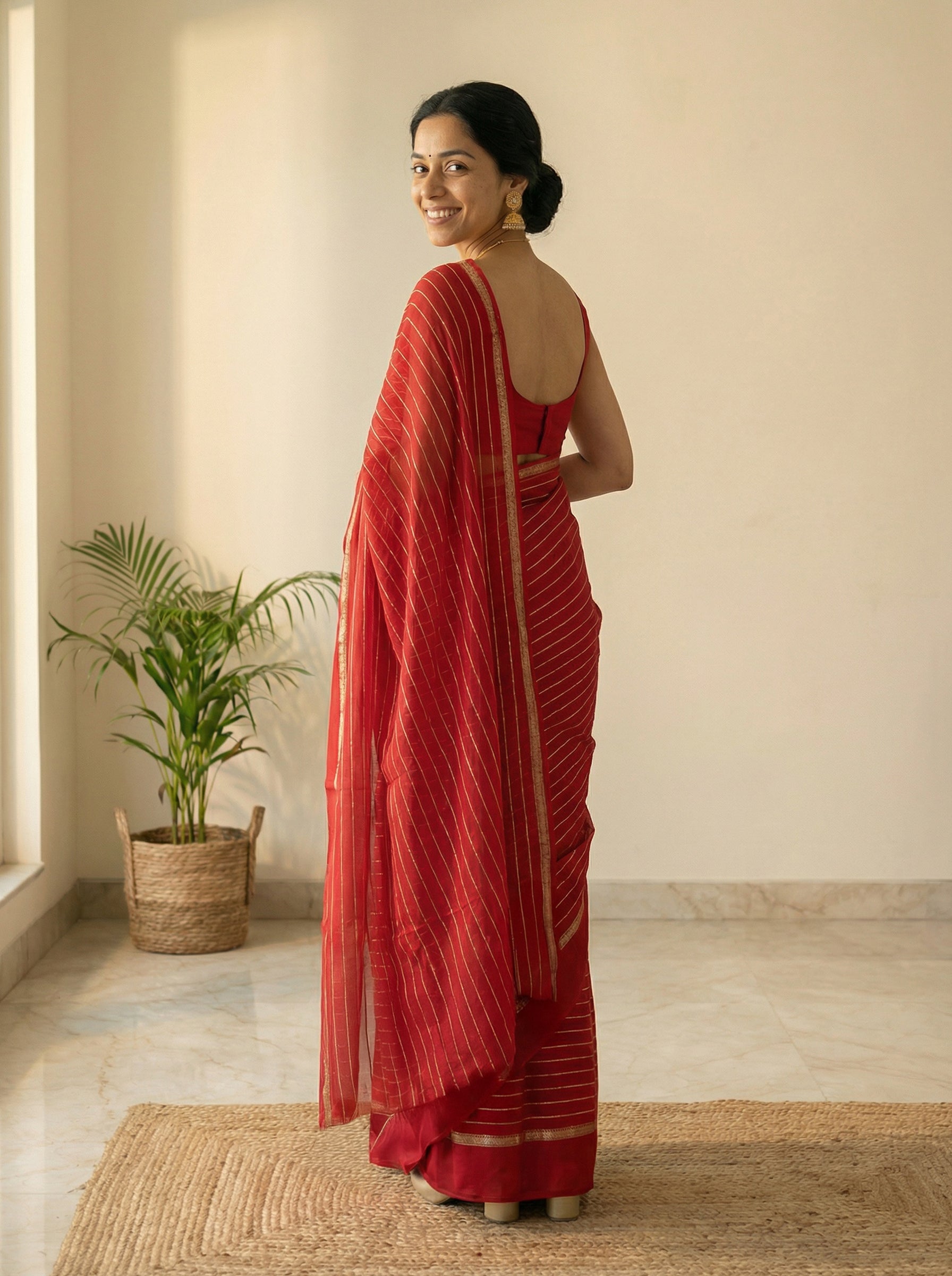 Synthetic Bright Red Saree with Elegant Gold Stripe Pattern