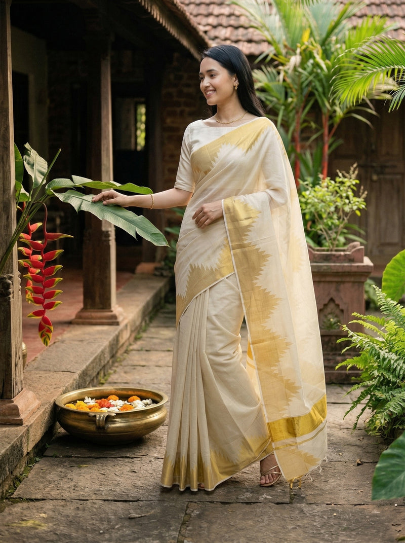 Woman in a traditional saree standing in a garden setting