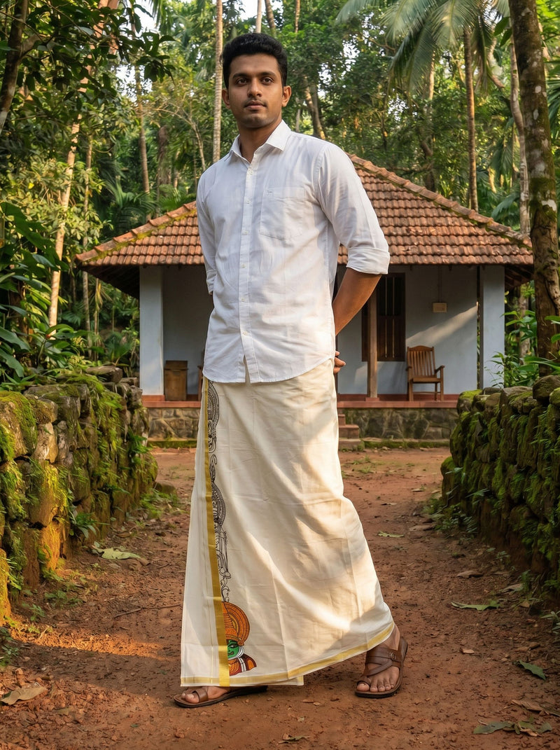 Man in traditional attire standing in a forested area with a house in the background