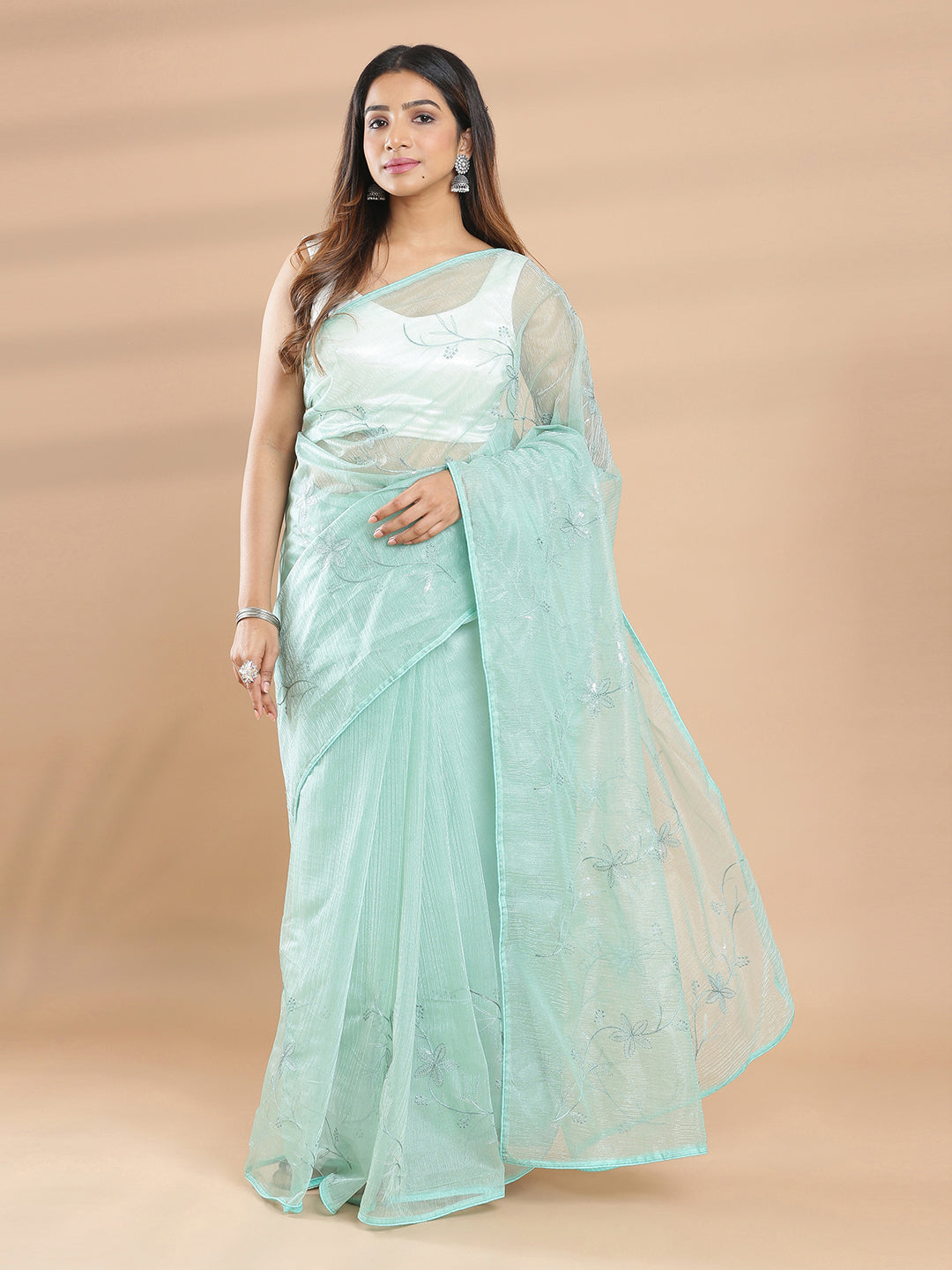 Light Teal Net Saree With Sequence And Floral Machine Embroidery Design