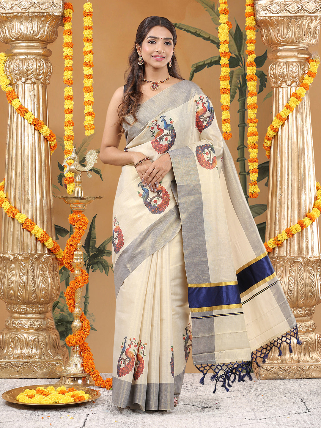 Tissue Golden Kerala Set Saree with Red-Blue Peacock Buttas and Royal Blue Kasavu Border