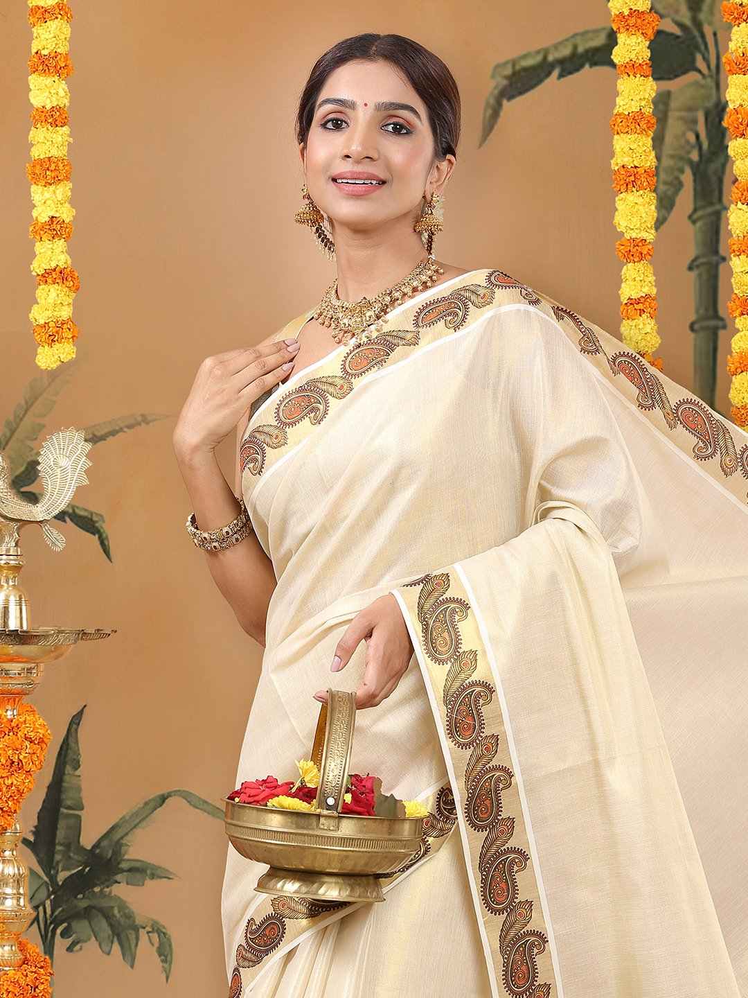 Kalyan Silks Golden Tissue Set Saree with Peacock Feather and Paisley Print On Golden Kasavu Border