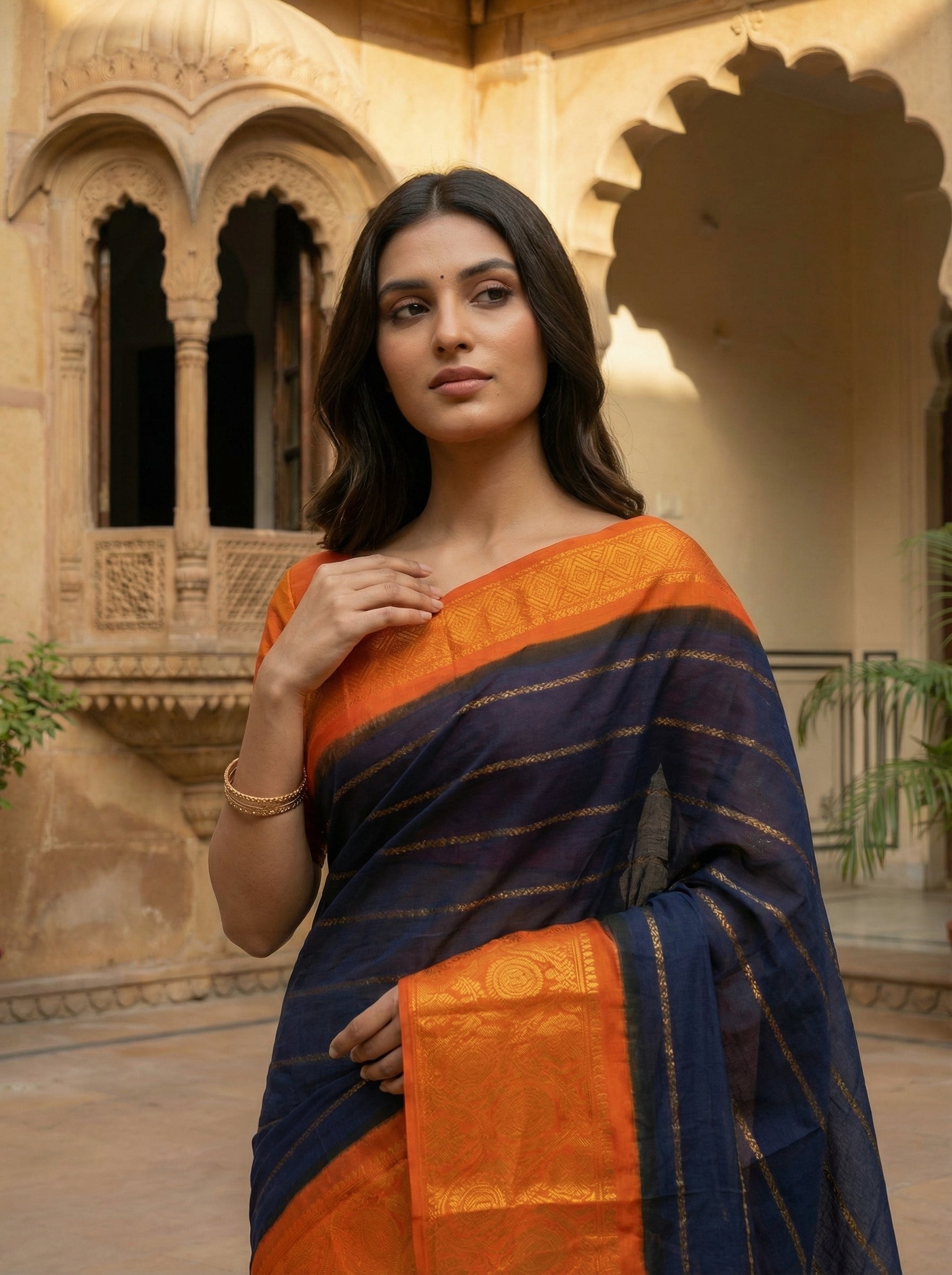 Midnight Blue Cotton Saree with Golden Stripe Weave and Bright Orange Zari Border