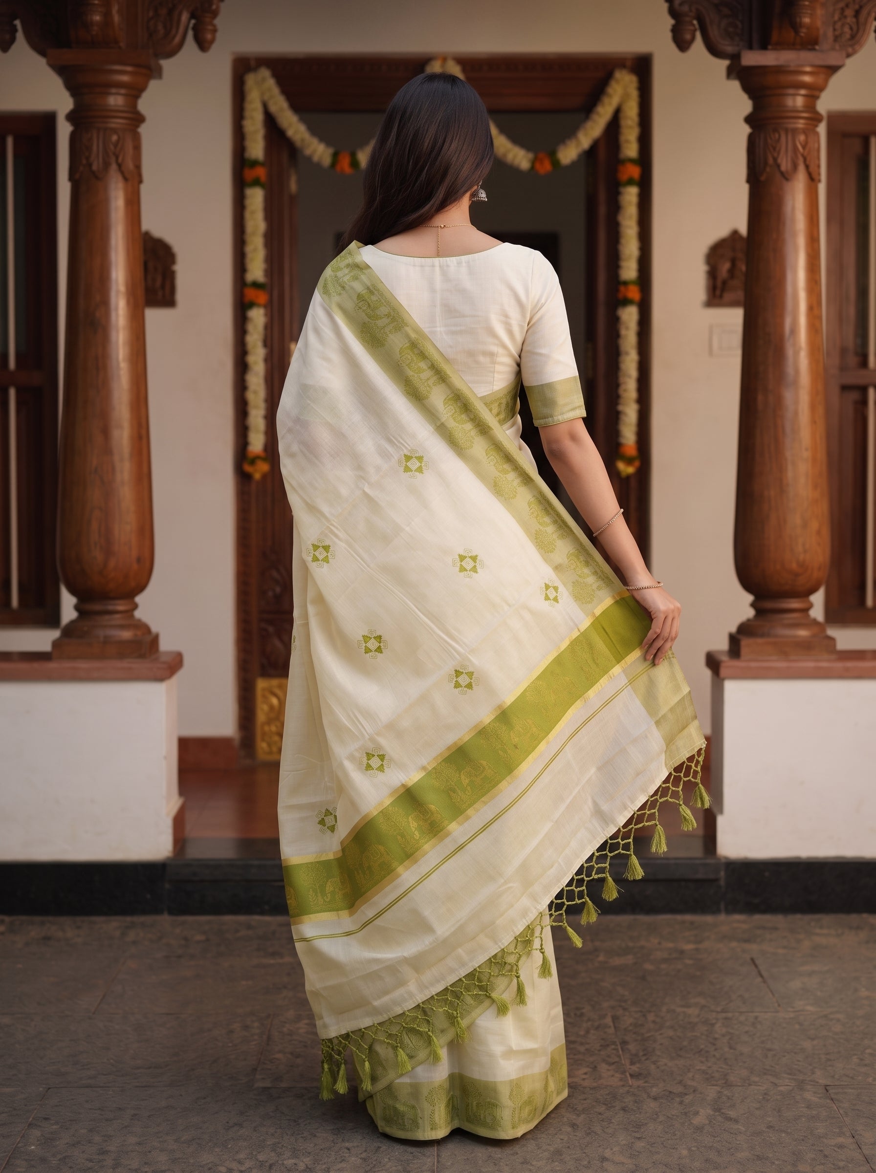 Tissue Cream Caparisoned Elephant Green Mural Border Onam Kerala Saree