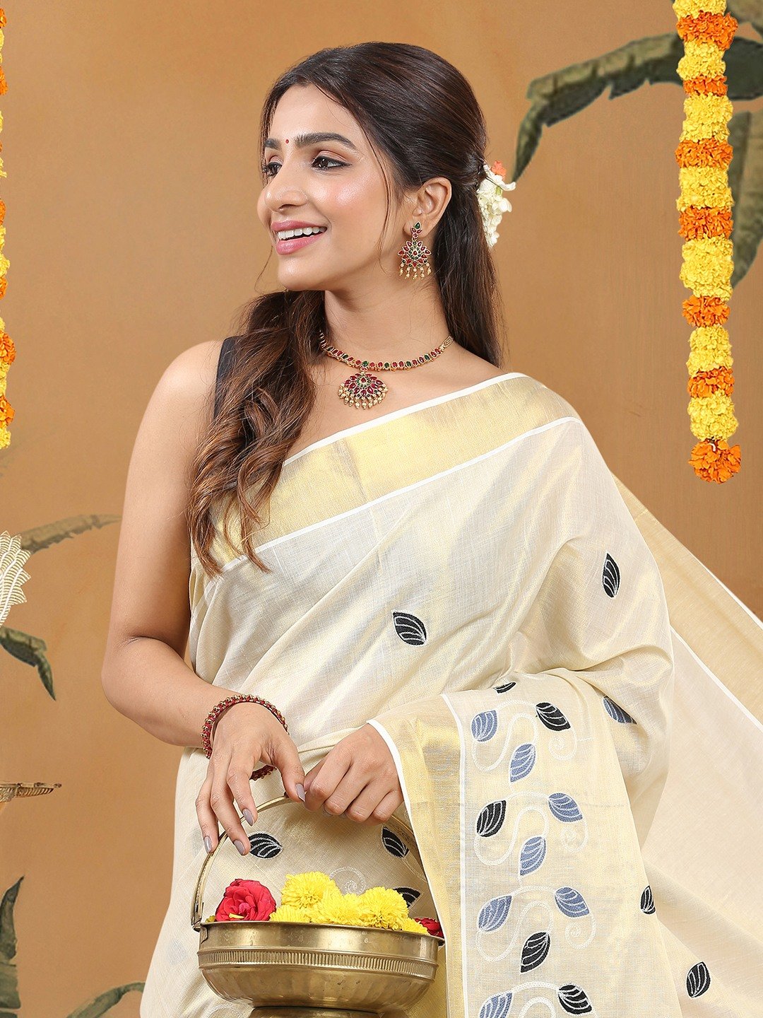 Golden Tissue Kerala Set Saree with Blue-Black Leaf Buttas and White Paisley Chain Embroidery